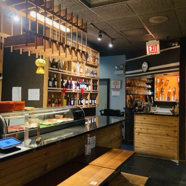 Amarit sushi bar with display case, wine shelves and bar
