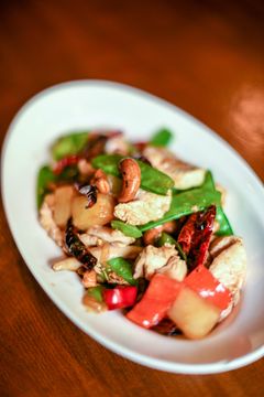 Cashew stir-fry with chicken, snow peas, bell pepper and dried chili