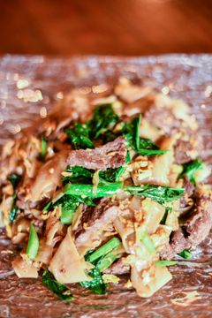 Pad see eiw, wide rice noodles with beef and Chinese broccoli