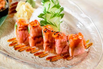 Pink Lady roll topped with torched salmon and sauce